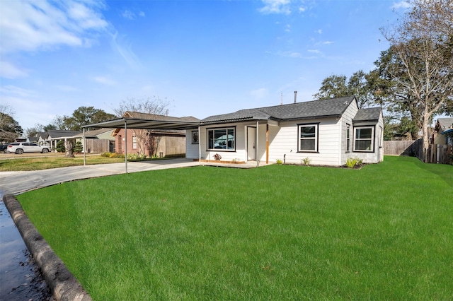 single story home with a front lawn and a carport