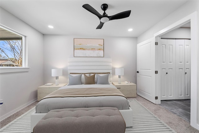 bedroom featuring ceiling fan, a closet, and carpet