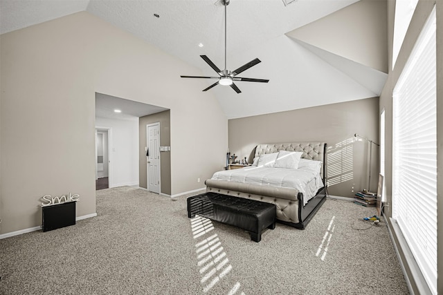 carpeted bedroom featuring ceiling fan and high vaulted ceiling