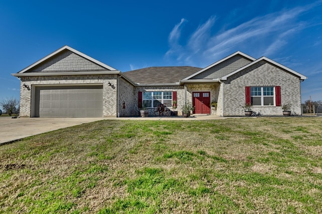 view of front of property with a garage and a front lawn