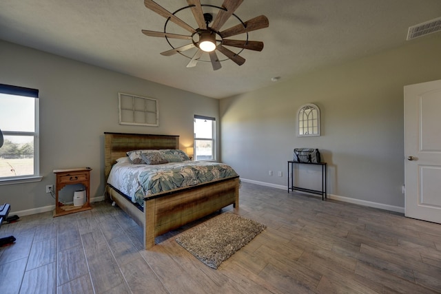 bedroom featuring ceiling fan and hardwood / wood-style flooring