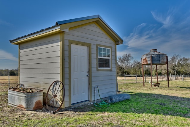 view of outbuilding with a lawn