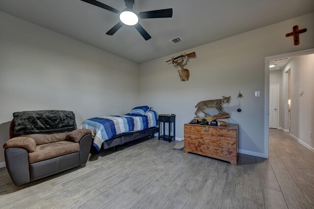 bedroom featuring ceiling fan and hardwood / wood-style flooring