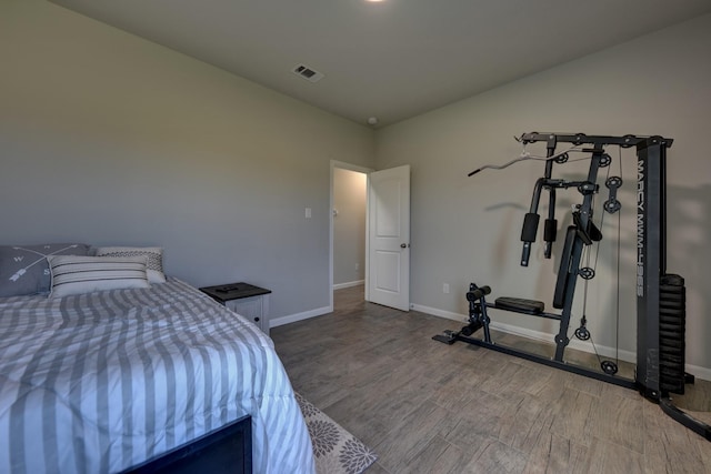 bedroom with wood-type flooring