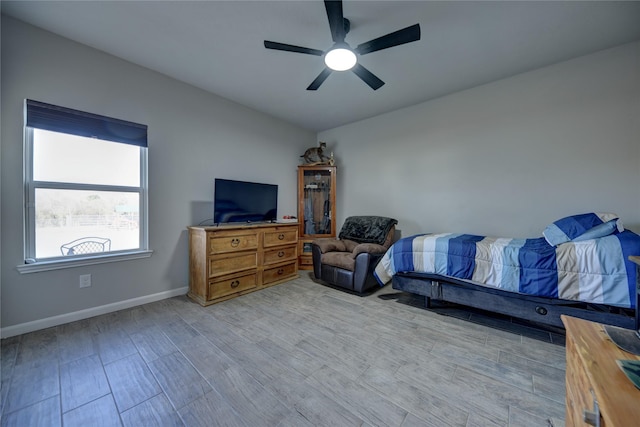 bedroom with ceiling fan and light hardwood / wood-style flooring