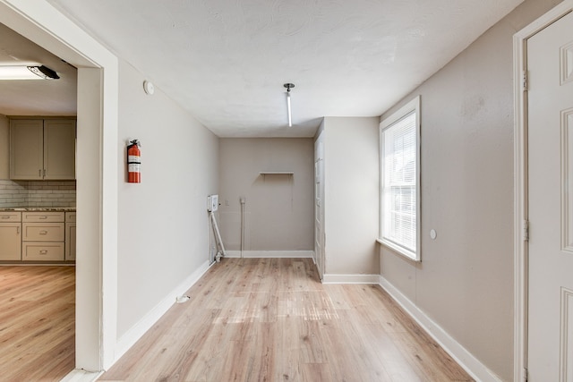 laundry room featuring light hardwood / wood-style flooring