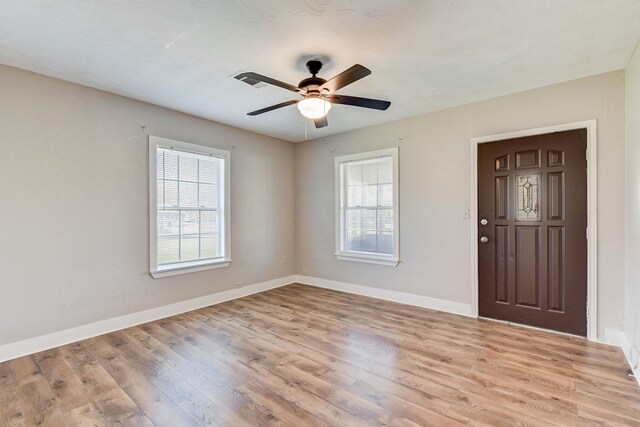 entryway featuring light wood-type flooring and ceiling fan