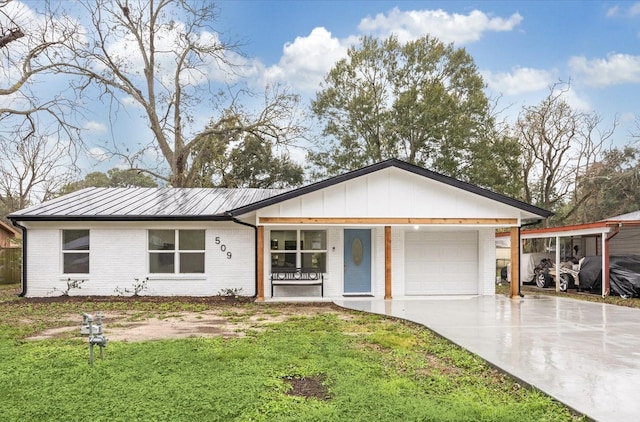 ranch-style house featuring a garage, a front yard, and a carport