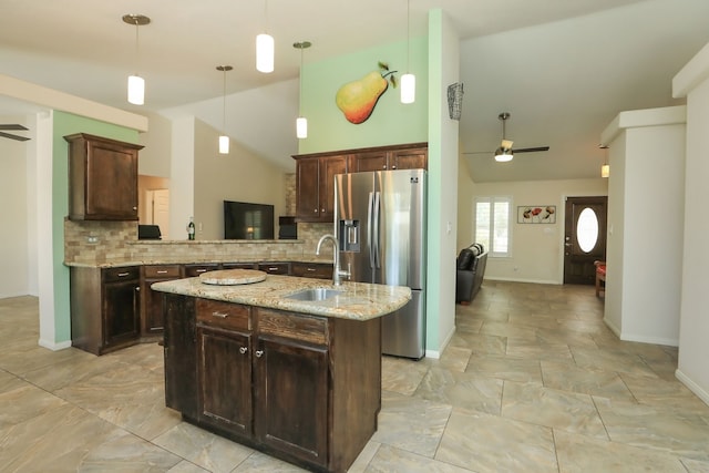 kitchen featuring lofted ceiling, ceiling fan, tasteful backsplash, decorative light fixtures, and stainless steel fridge with ice dispenser