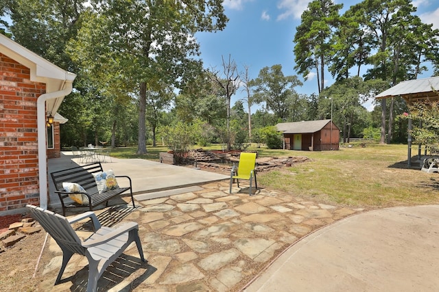 view of patio featuring a shed