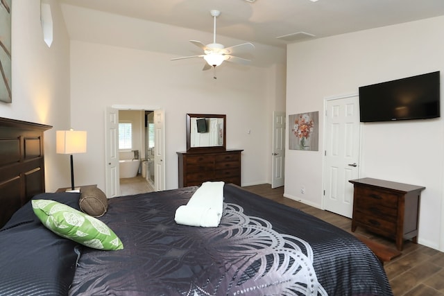 bedroom with ensuite bathroom, ceiling fan, and dark hardwood / wood-style floors