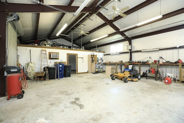 garage with ceiling fan and a workshop area