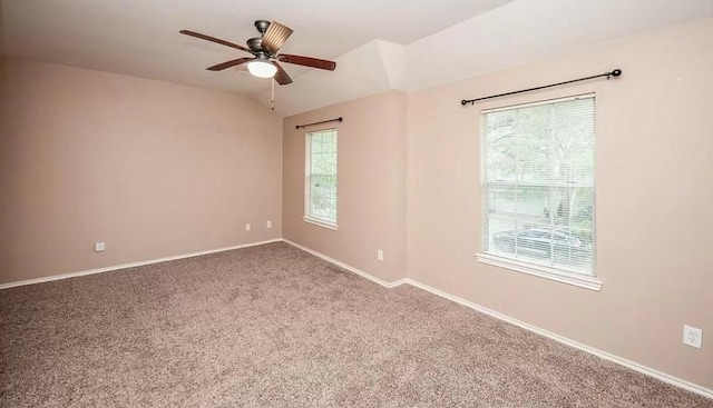 empty room with carpet, ceiling fan, and a wealth of natural light