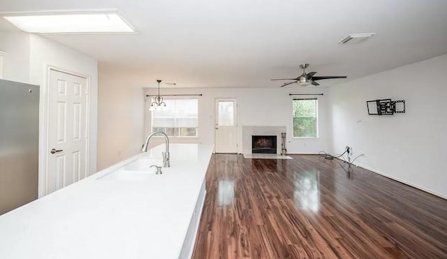 kitchen with decorative light fixtures, sink, plenty of natural light, and ceiling fan