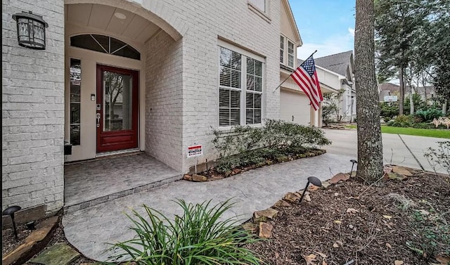 property entrance with a garage