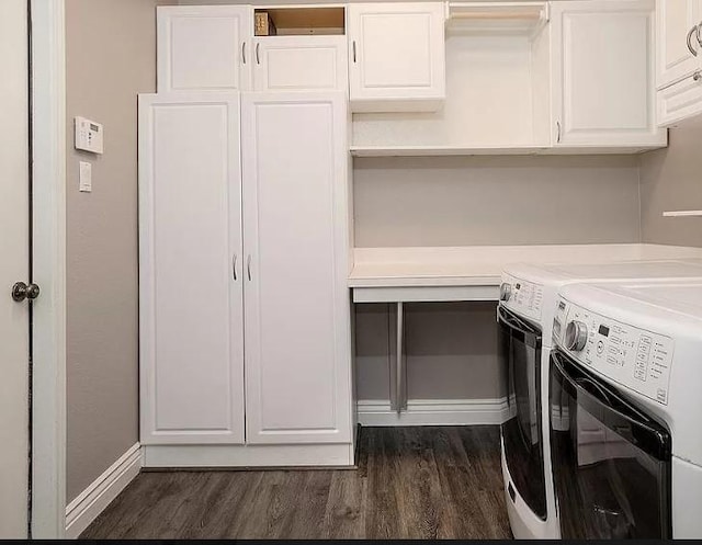 laundry room with cabinets, independent washer and dryer, and dark hardwood / wood-style floors