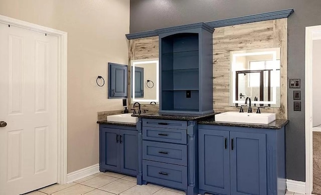 bathroom with tile patterned floors and vanity