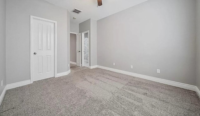 unfurnished bedroom featuring ceiling fan and carpet floors