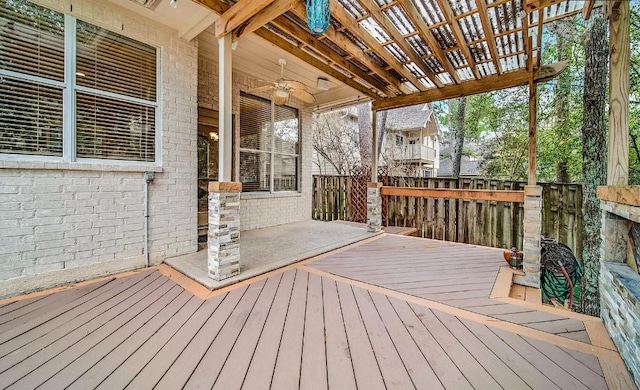 wooden terrace featuring ceiling fan