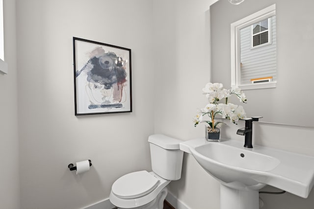 bathroom with sink and toilet