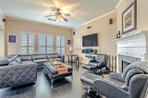 living room featuring ceiling fan and crown molding