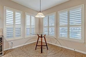 unfurnished dining area featuring tile patterned floors