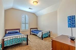 bedroom featuring lofted ceiling and carpet flooring