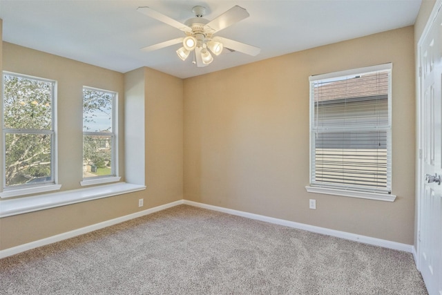 empty room with ceiling fan and light colored carpet