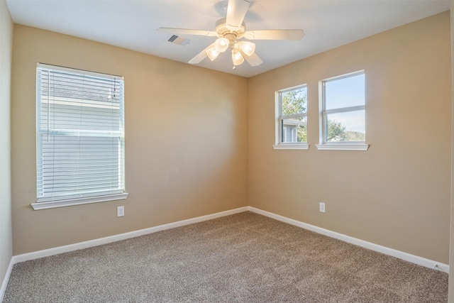 carpeted empty room with ceiling fan