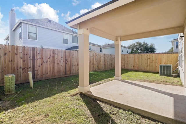 view of yard featuring a patio area and central AC unit