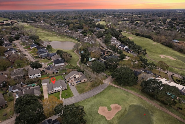 aerial view at dusk with a water view