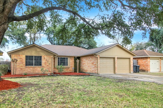 ranch-style home with a front lawn and a garage