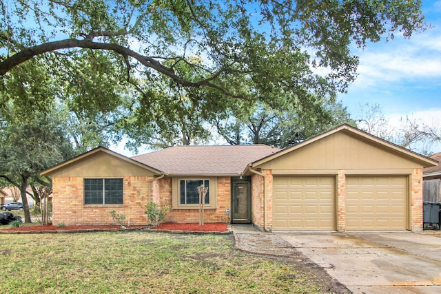 ranch-style house featuring a garage and a front lawn