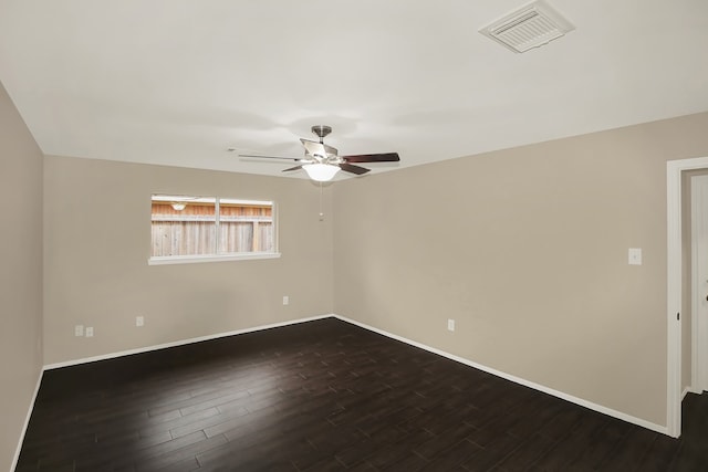 empty room featuring ceiling fan and dark hardwood / wood-style floors