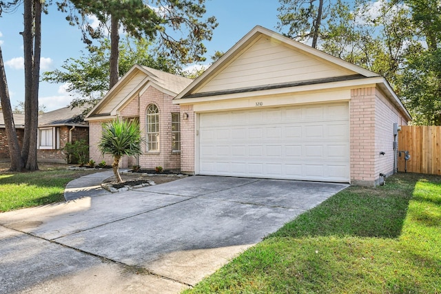 single story home with a front yard and a garage