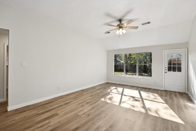 unfurnished living room featuring ceiling fan, hardwood / wood-style flooring, and lofted ceiling