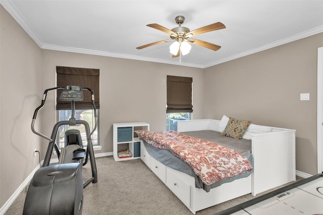 carpeted bedroom with crown molding and ceiling fan