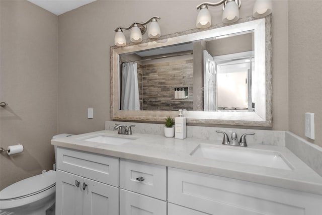 bathroom with vanity, toilet, and a shower with shower curtain