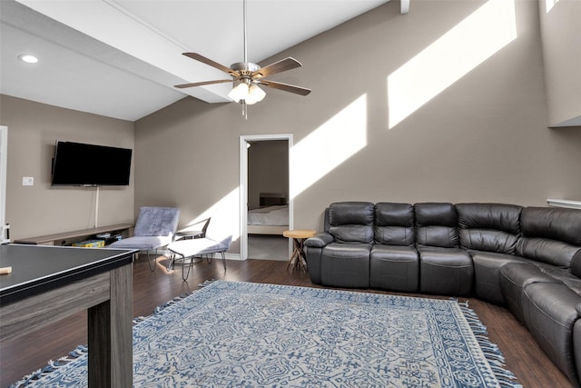 living room with lofted ceiling, dark hardwood / wood-style flooring, and ceiling fan