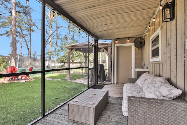 unfurnished sunroom featuring a wealth of natural light