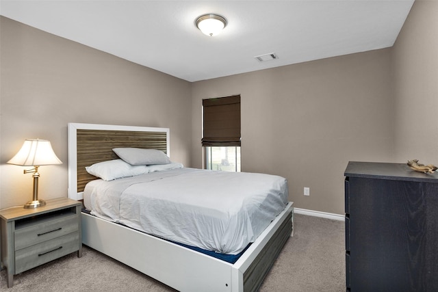 bedroom with light colored carpet