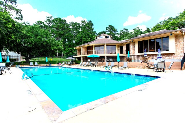 view of pool featuring a patio