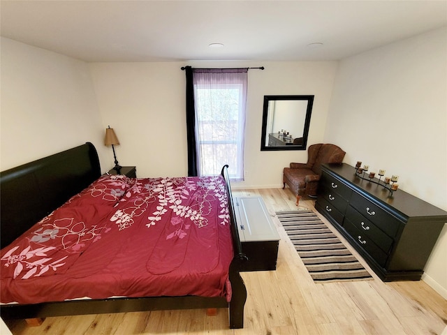 bedroom with light wood-type flooring