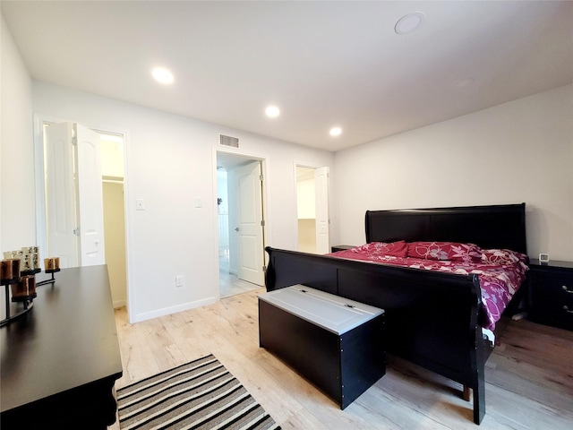 bedroom with light hardwood / wood-style floors