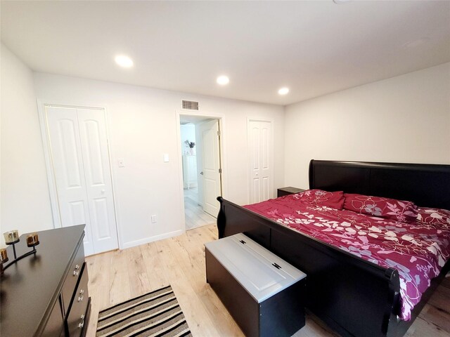 bedroom with light hardwood / wood-style flooring