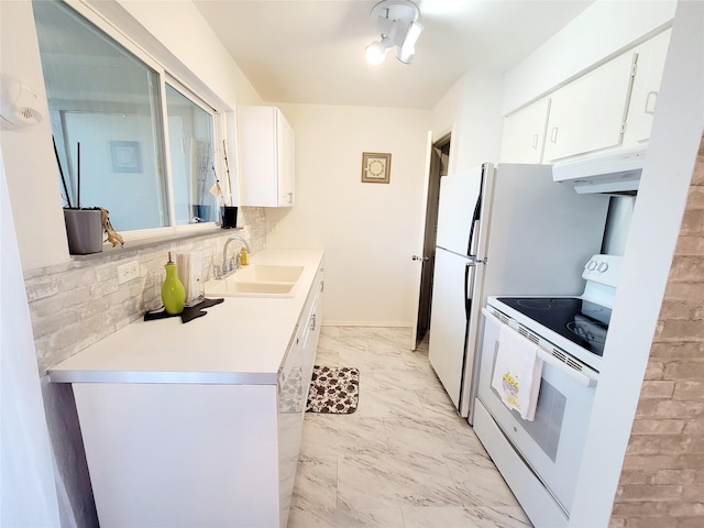 kitchen featuring sink, white cabinets, white electric range oven, and tasteful backsplash