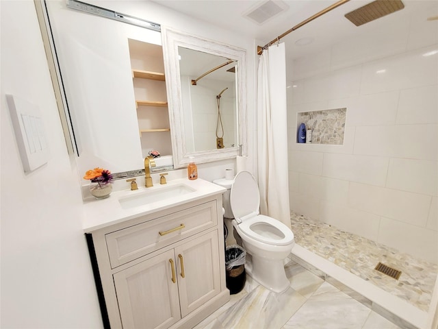 bathroom with walk in shower, vanity, and toilet