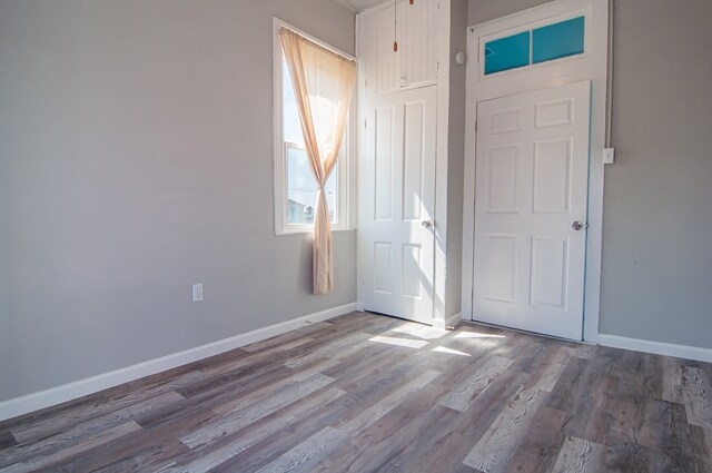 entryway with hardwood / wood-style flooring