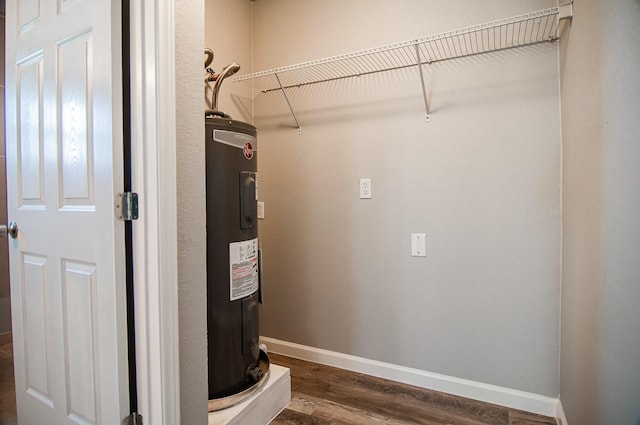 utility room featuring water heater