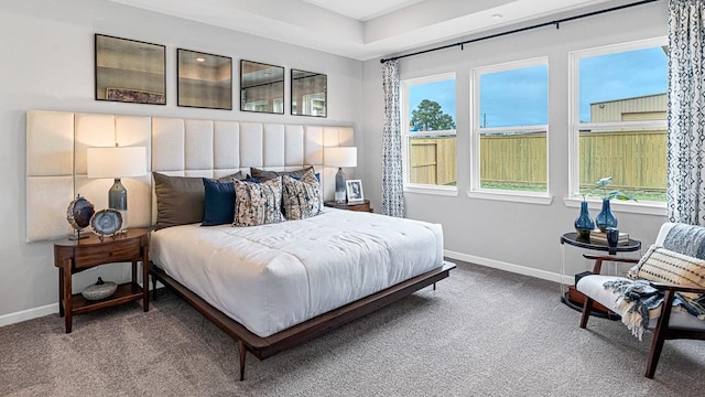 bedroom featuring baseboards and carpet flooring